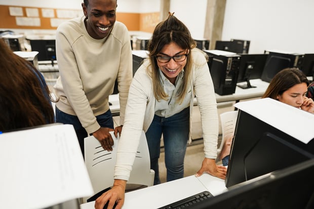teacher-working-with-students-inside-computer-clas-2025-02-21-15-55-10-utc
